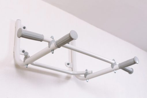 Pull up bars white atached to the wall.jpg